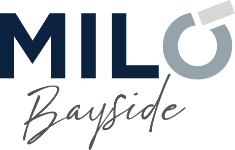 A logo with the text "MIL Bayside" and a graphic of a key.